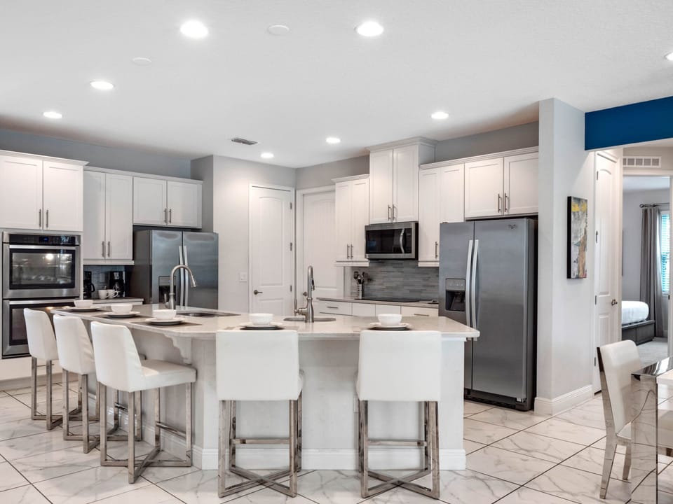 Kitchen area with stainless steel appliances and spacious island