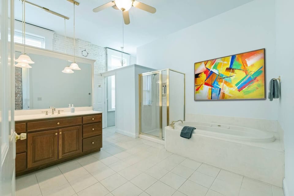 Large bathroom with double vanity and soaker tub