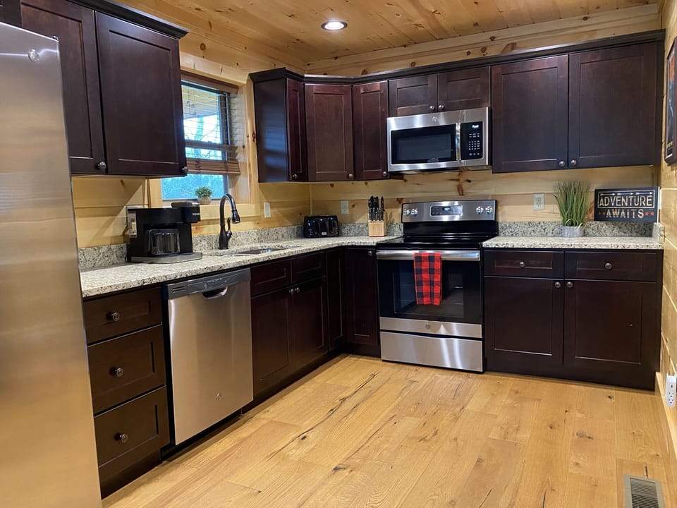 Plenty of counter space and 4 place stove with electric oven and microwave