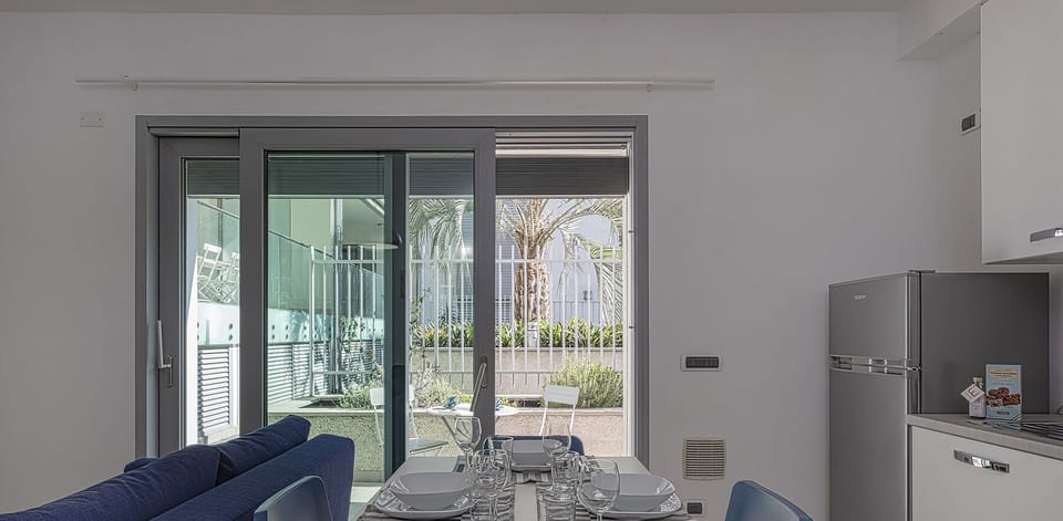 Business Apartment | Living area | 24-inch flat-screen TV with digital channels, TV