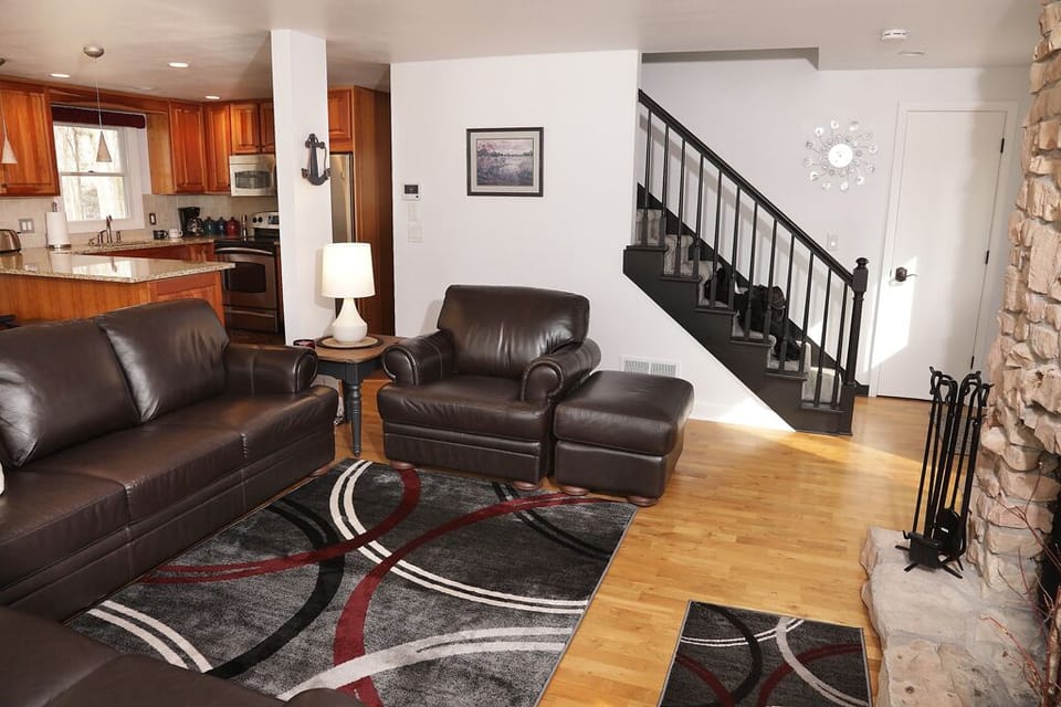 Cozy living room with a 65" Smart TV, cable, DVD and blu ray player