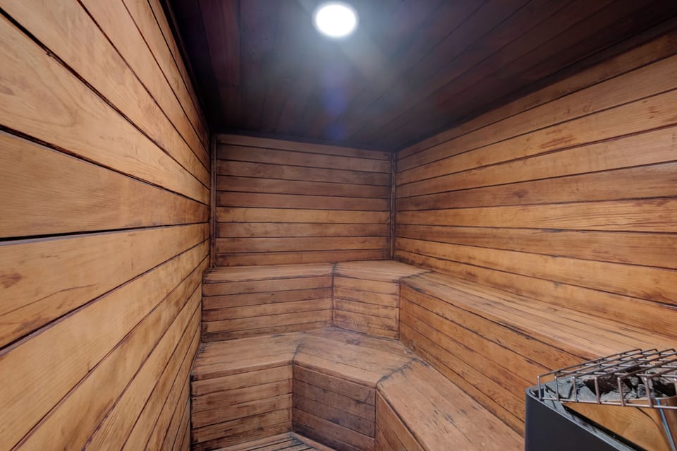 Unwind in your private sauna, where warm cedar surrounds you and soft lighting creates the perfect atmosphere for deep relaxation.