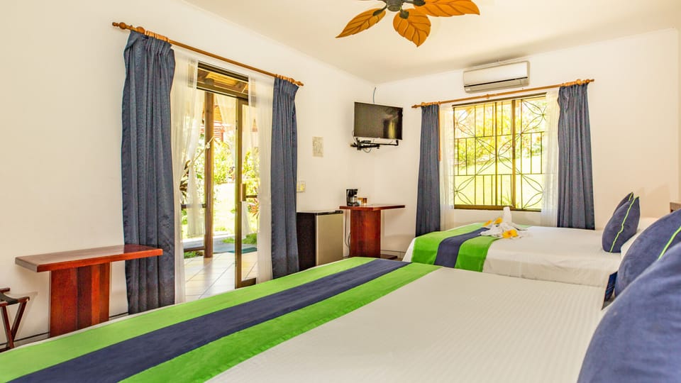 Double King Deluxe | Blackout drapes, free cribs/infant beds, free WiFi, bed sheets