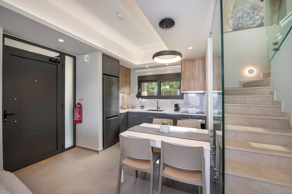 Fully equipped open plan kitchen with modern fixtures and appliances