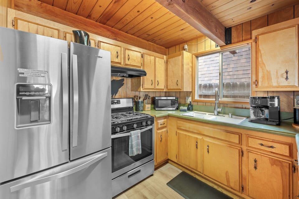 Homey Kitchen and Dining –  A fully stocked kitchen with rustic wood finishes 