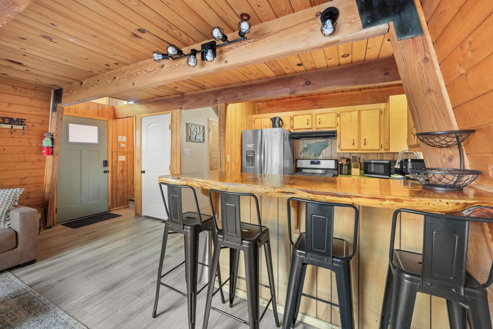 Homey Kitchen and Dining –  A fully stocked kitchen with rustic wood finishes 