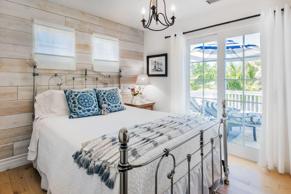 Bedroom 3 - Queen Size bed.  Large private patio overlooking the pool area.