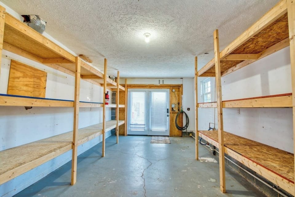 Vast mudroom/storage room is at your complete disposal.