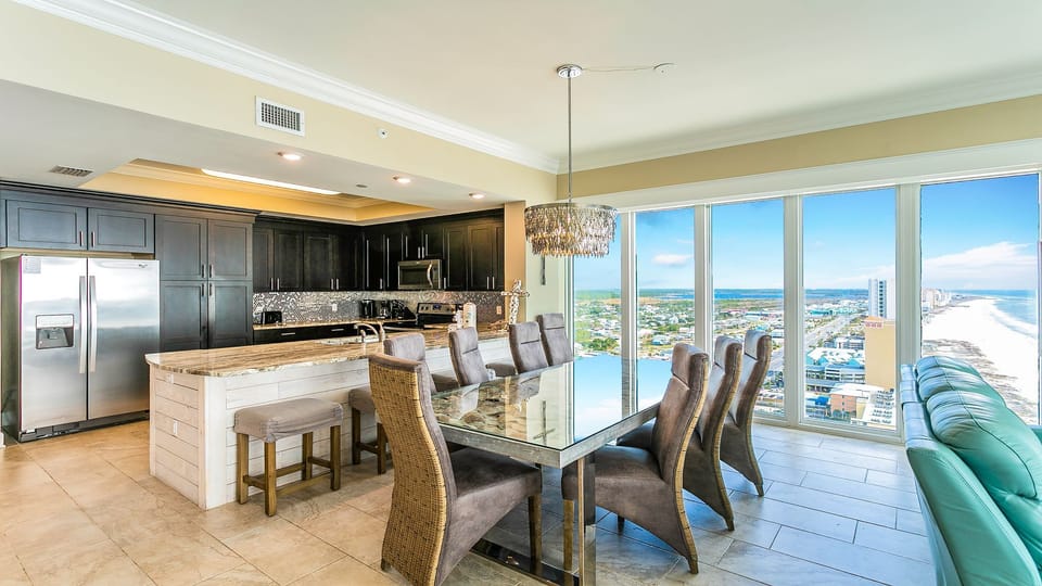 Dining Table, Stainless Appliances, Chandelier, Penthouse View, Kitchen, Stools.