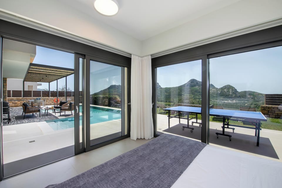 Ground floor bedroom offers direct access to pool area