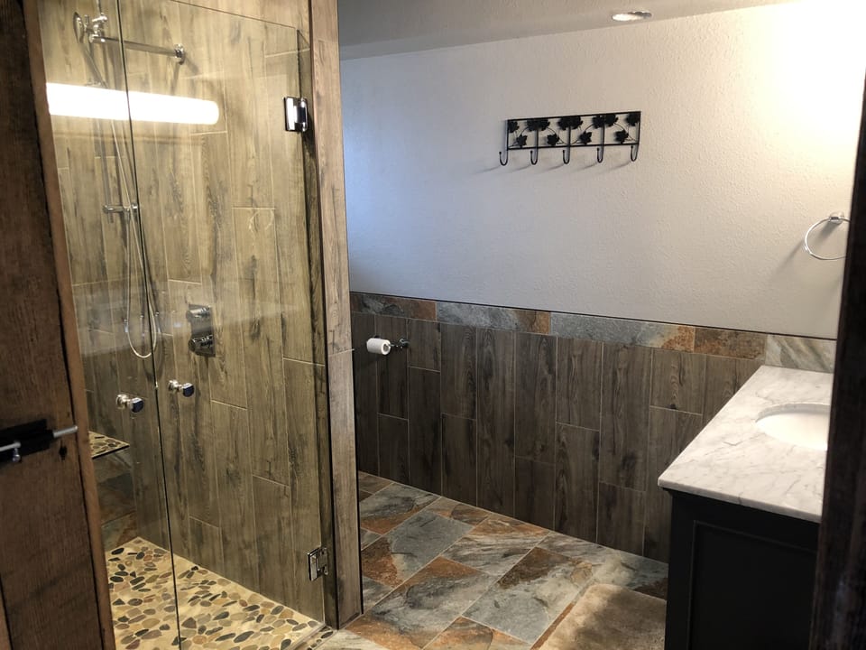 Master bath #1, handicap accessible shower and toilet.