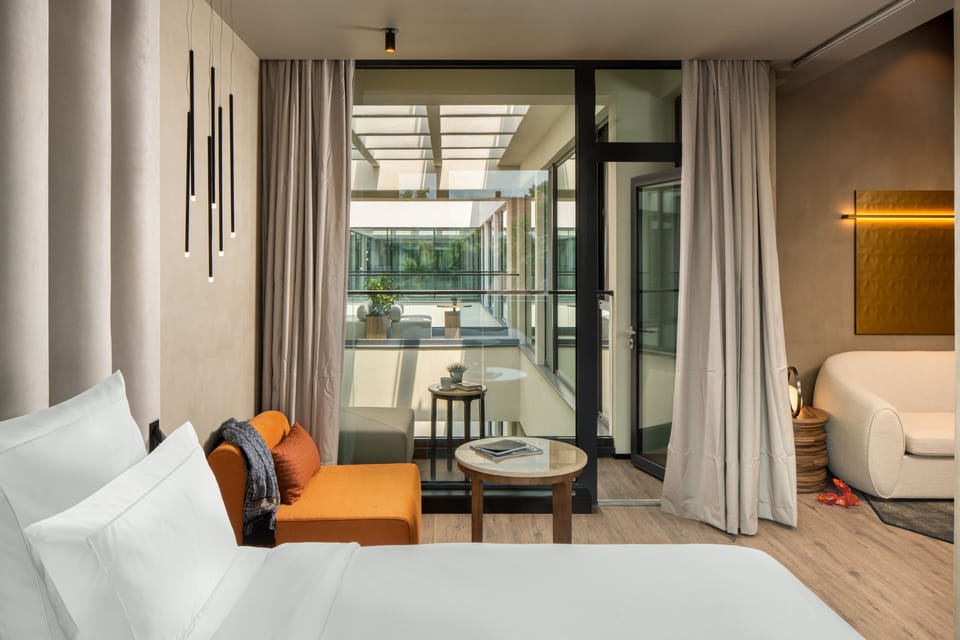 Deluxe Suite, 1 King Bed, Balcony | Bathroom | Eco-friendly toiletries, hair dryer, bathrobes, slippers