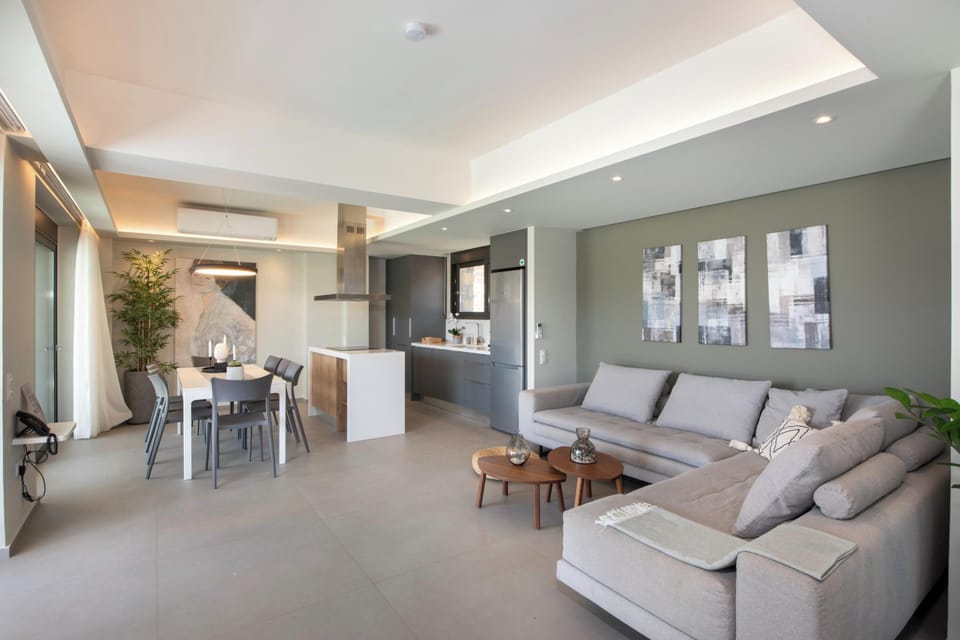 Ground floor living room with corner sofa and direct access to pool area
