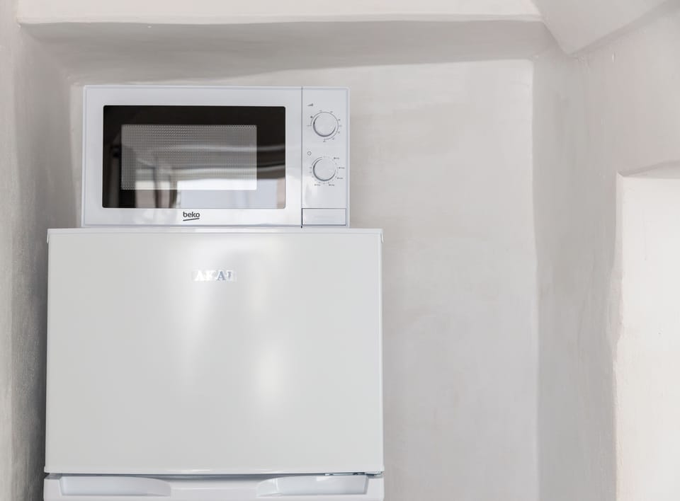 Apartment, 1 Bedroom | Private kitchen | Full-size fridge, microwave, cookware/dishes/utensils, cleaning supplies