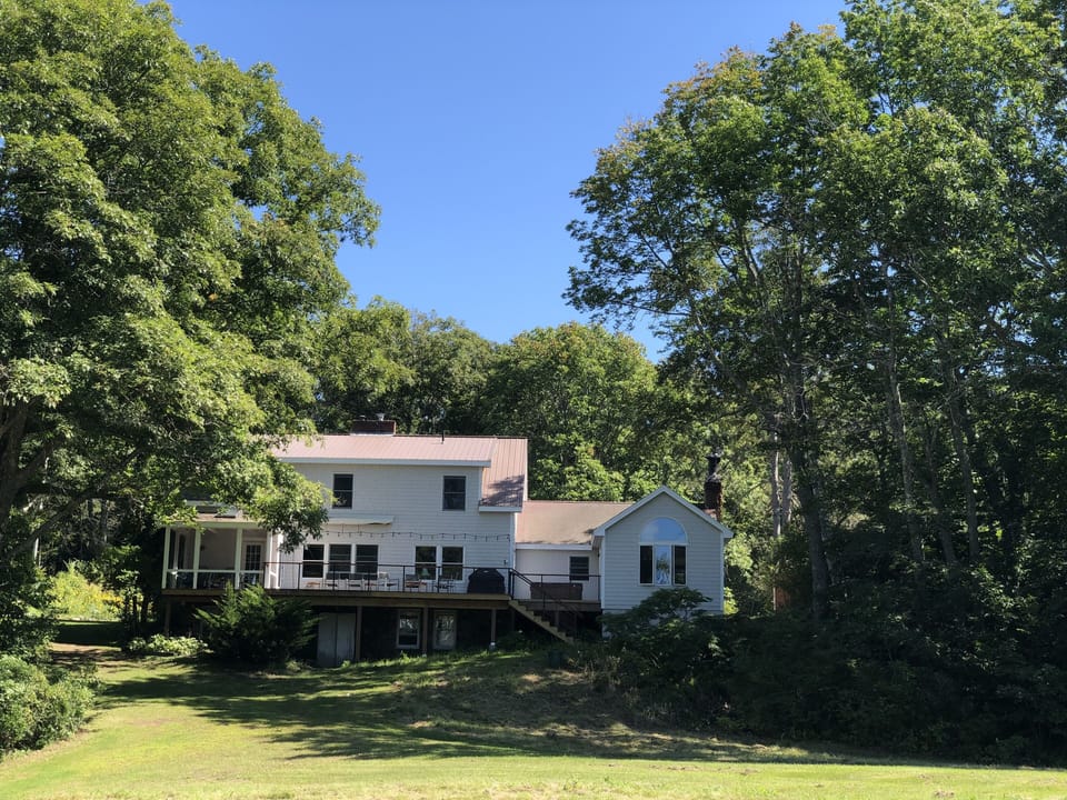 View of back side of house with screened porch & deck