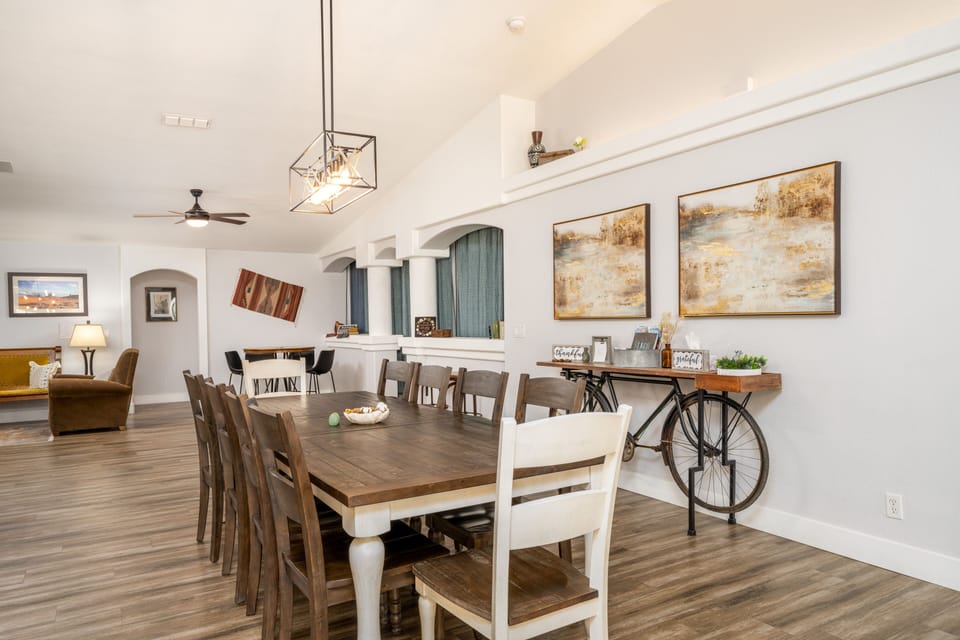 Welcome to your dining space, large table shared with a pub set & eat-in bar.
