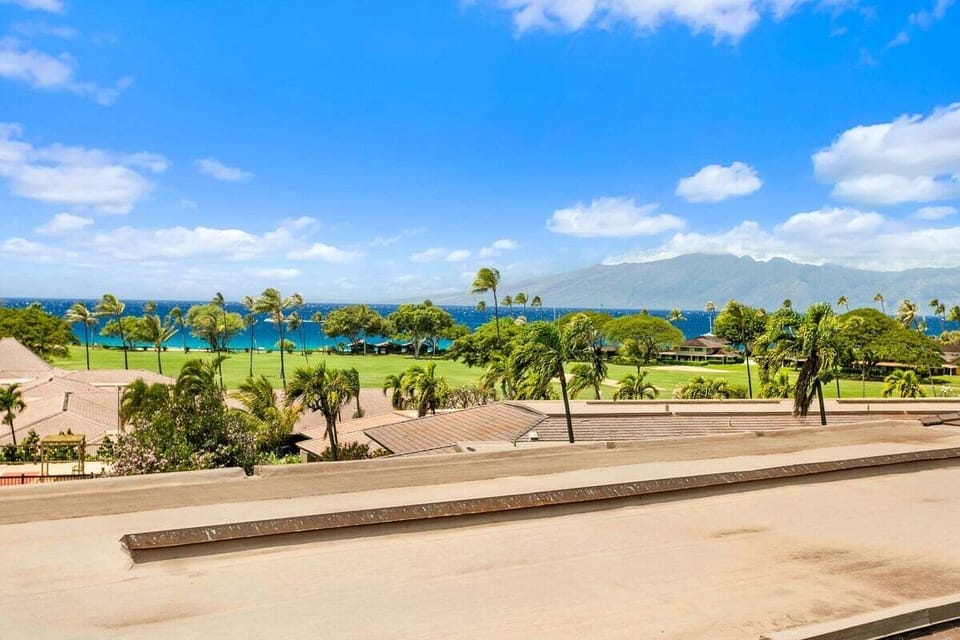 Relax on your private lanai with sweeping views of the resort lawn and the Pacific ocean