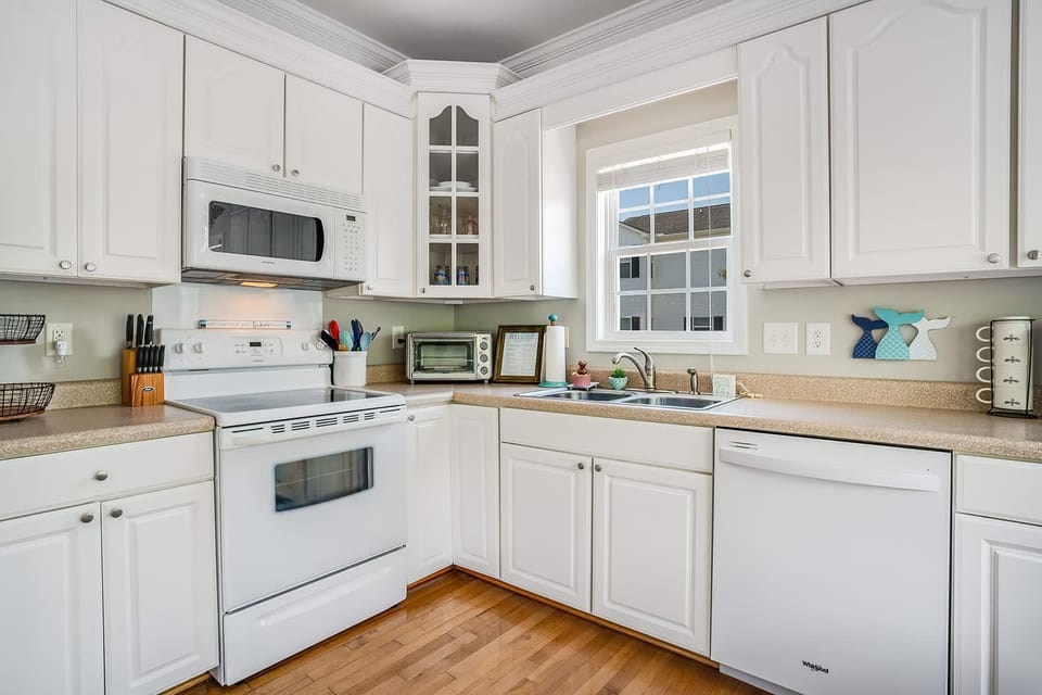 Bright, airy kitchen with modern appliances and cozy charm