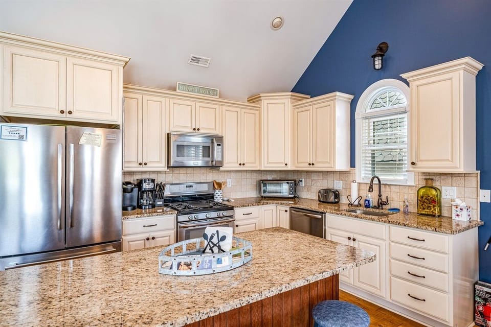 Modern kitchen area with off the top amenities