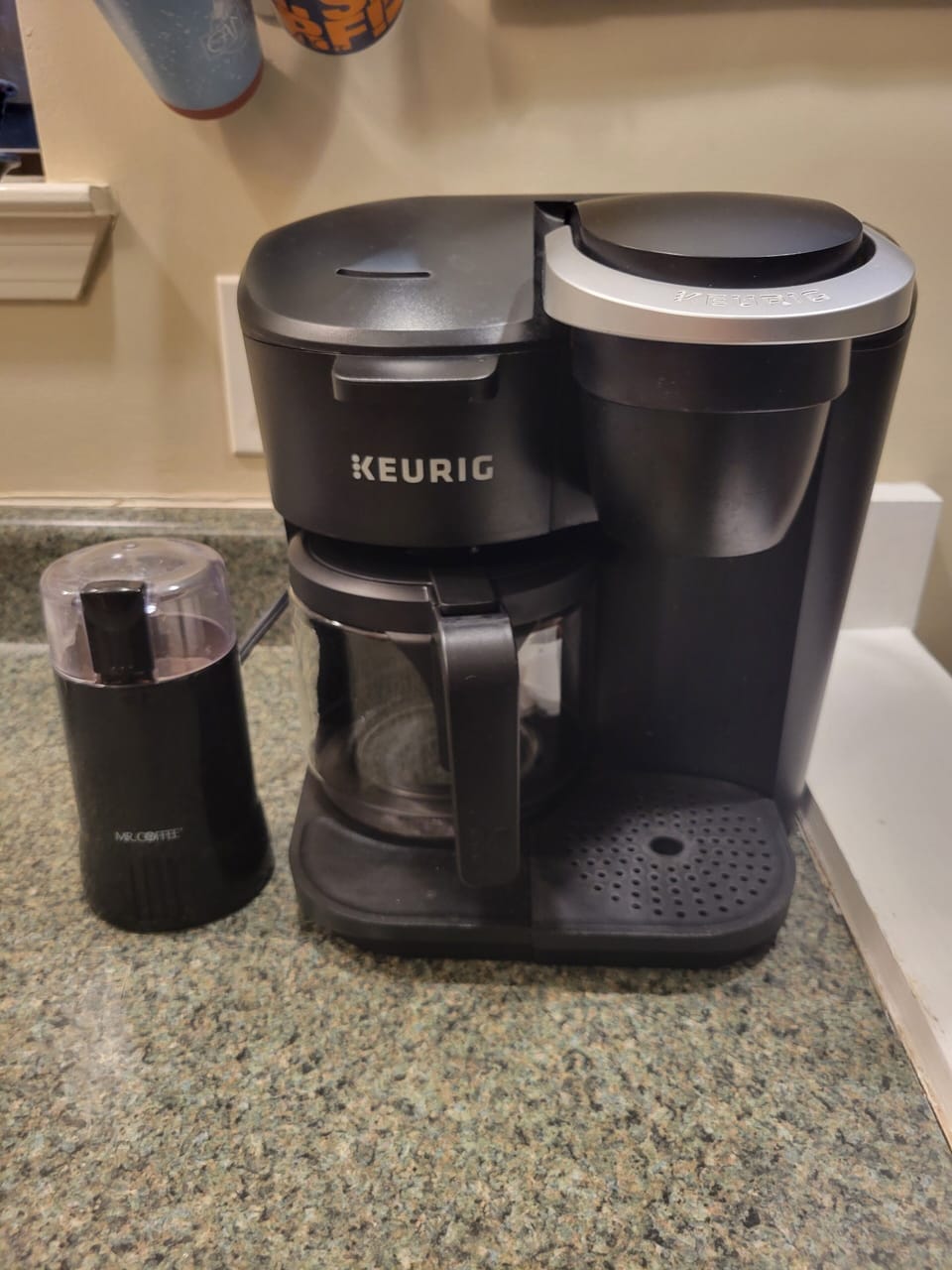Coffee station with both drip and pod coffee makers and a bean grinder 