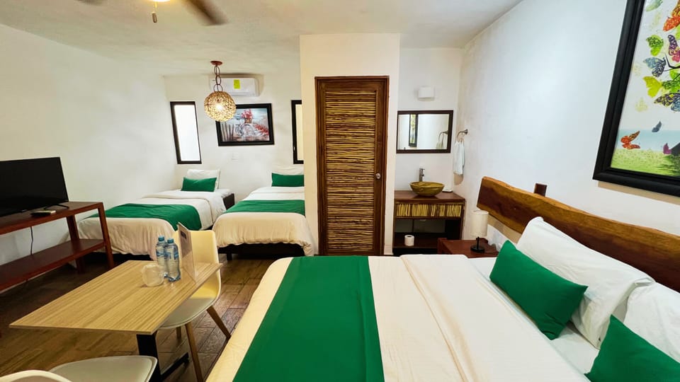 Family Room, Garden View | Desk, laptop workspace, free WiFi, bed sheets
