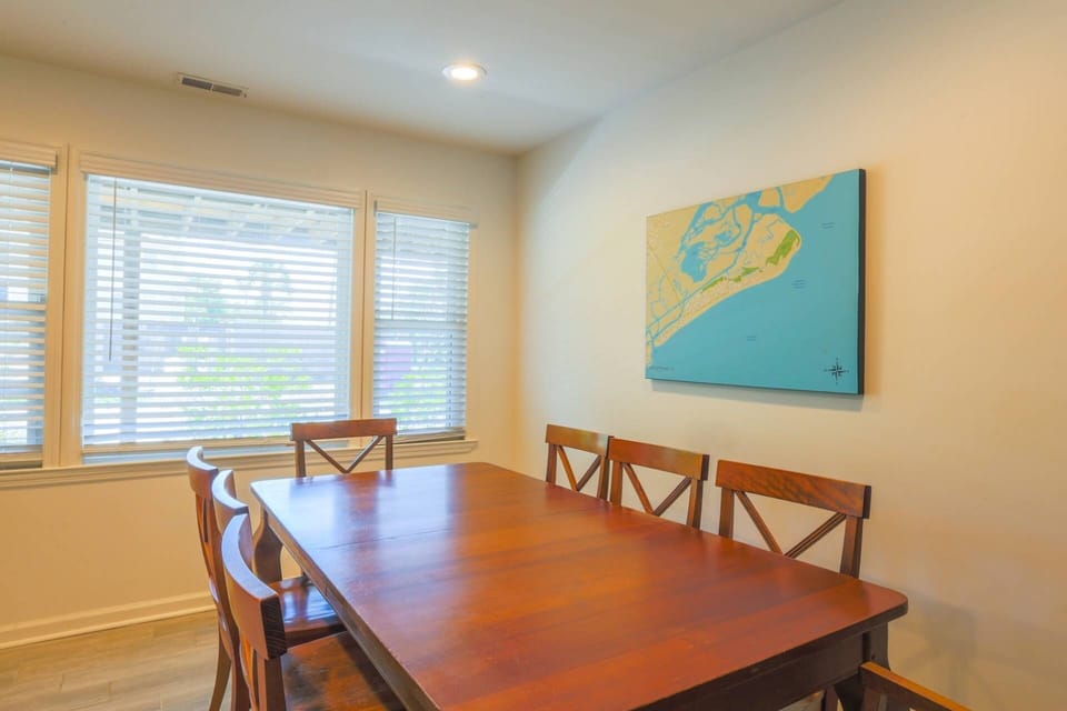 The dining room looks out onto the covered patio on the front of the home.