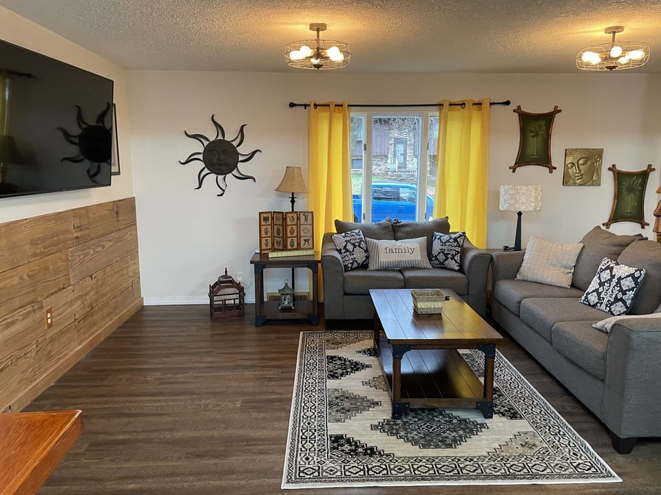 Flat screen smart TV and comfy couches.