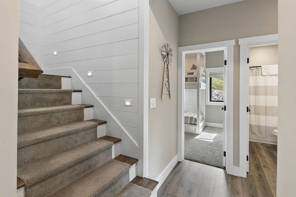 Lighted stairway to 5 bedrooms downstairs