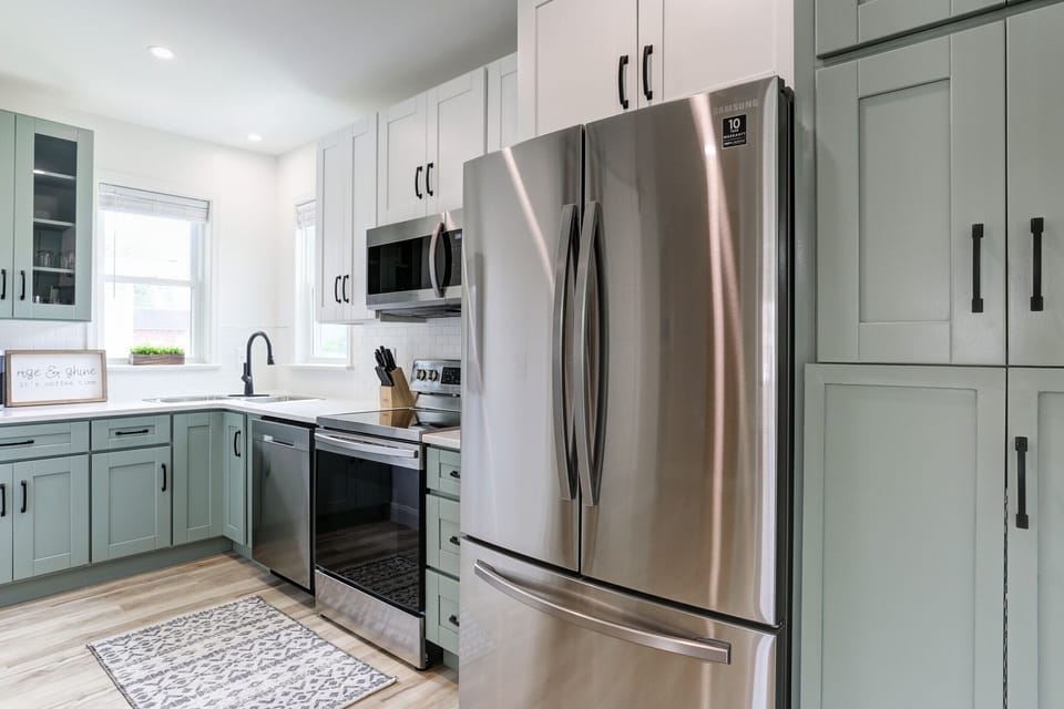 New appliances with 2 in 1 washer and dryer in kitchen for your convenience.