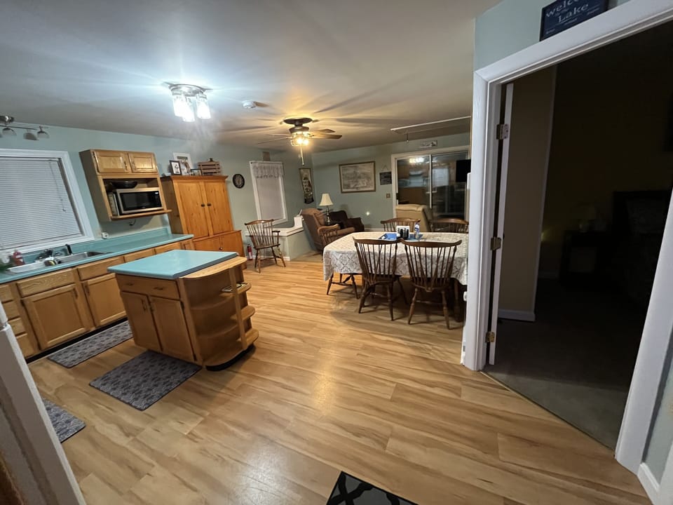 View from entry into kitchen/dining and living area beyond. 