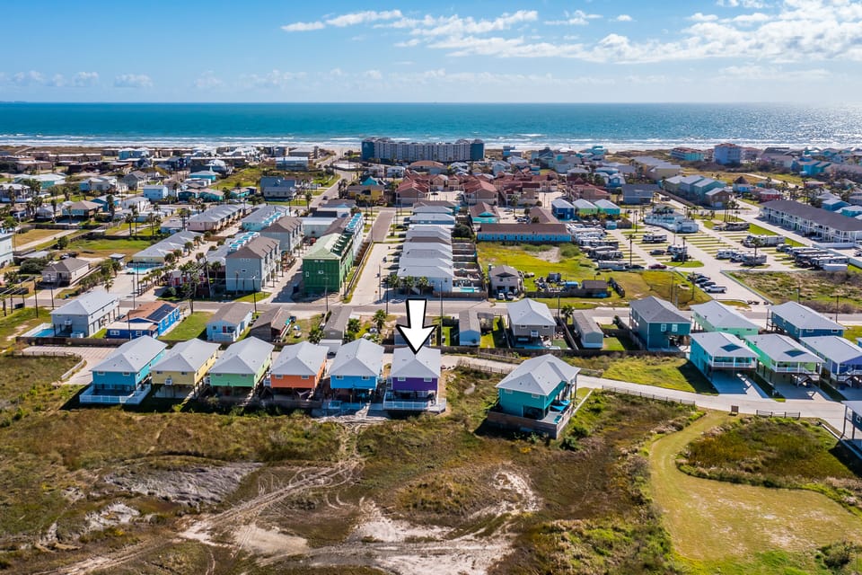 Located a short walk or even shorter golf cart ride to the beach.