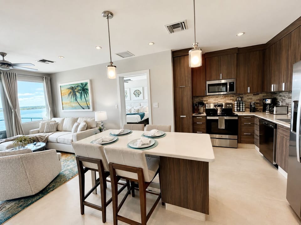 Entrance view of kitchen (dining for 4) and living area.