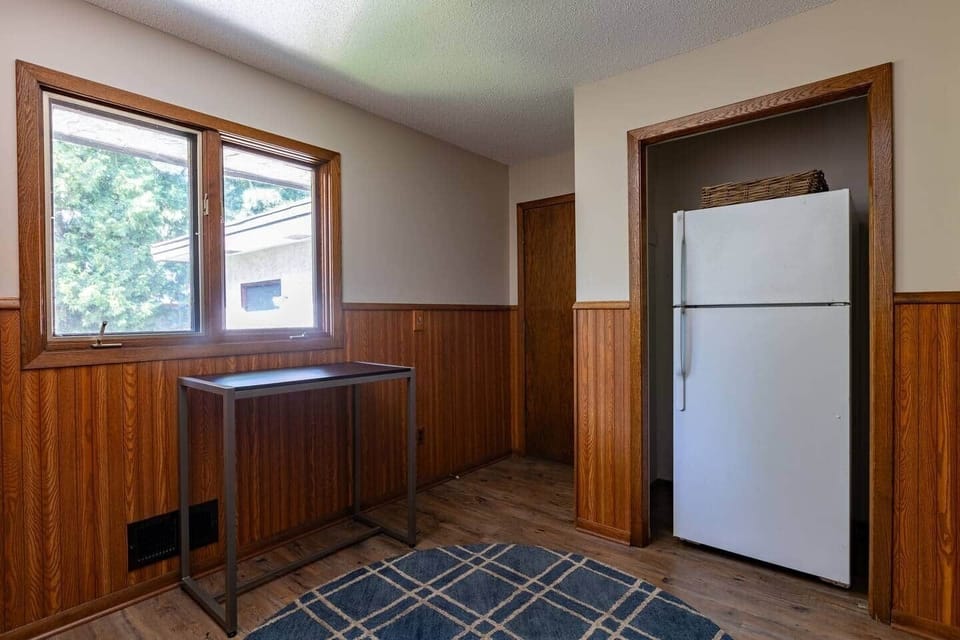 A second refrigerator in mudroom off the main kitchen to store extra food and beverages.