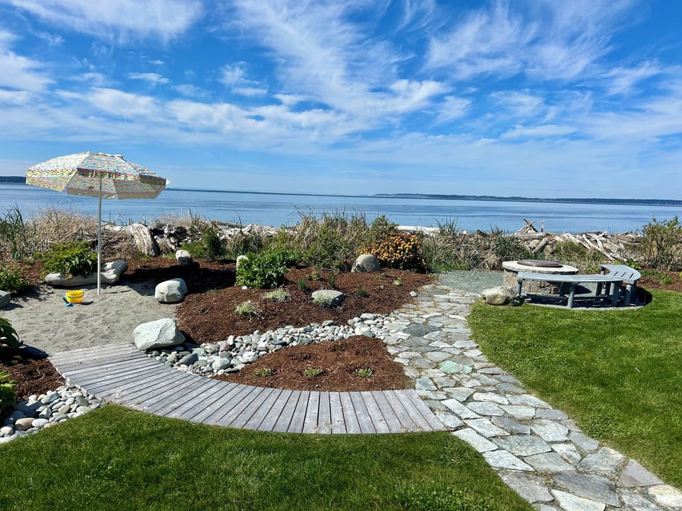 Path to beach with sand pit and firepit