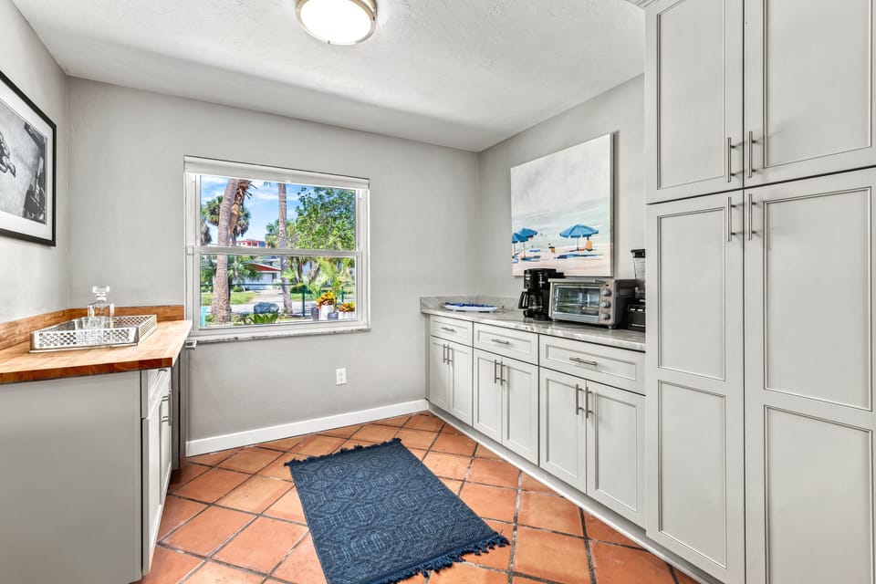 The kitchen nook with a coffee and beverage bar. Brew your favorite cup with both Keurig and traditional options—morning rituals and cocktail hour made simple.
