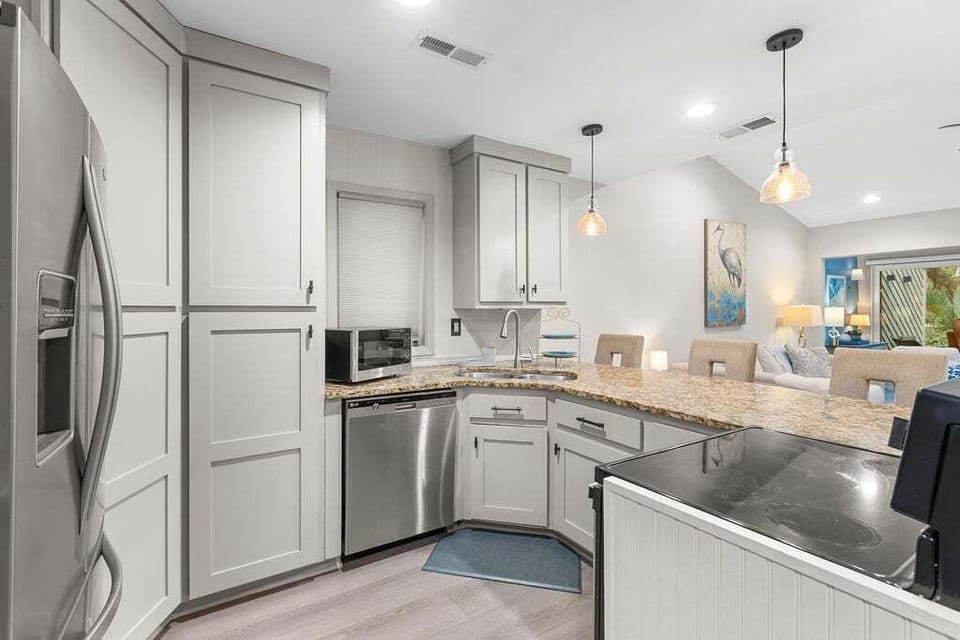 Enter this adorable light-filled cottage with its open floor plan.