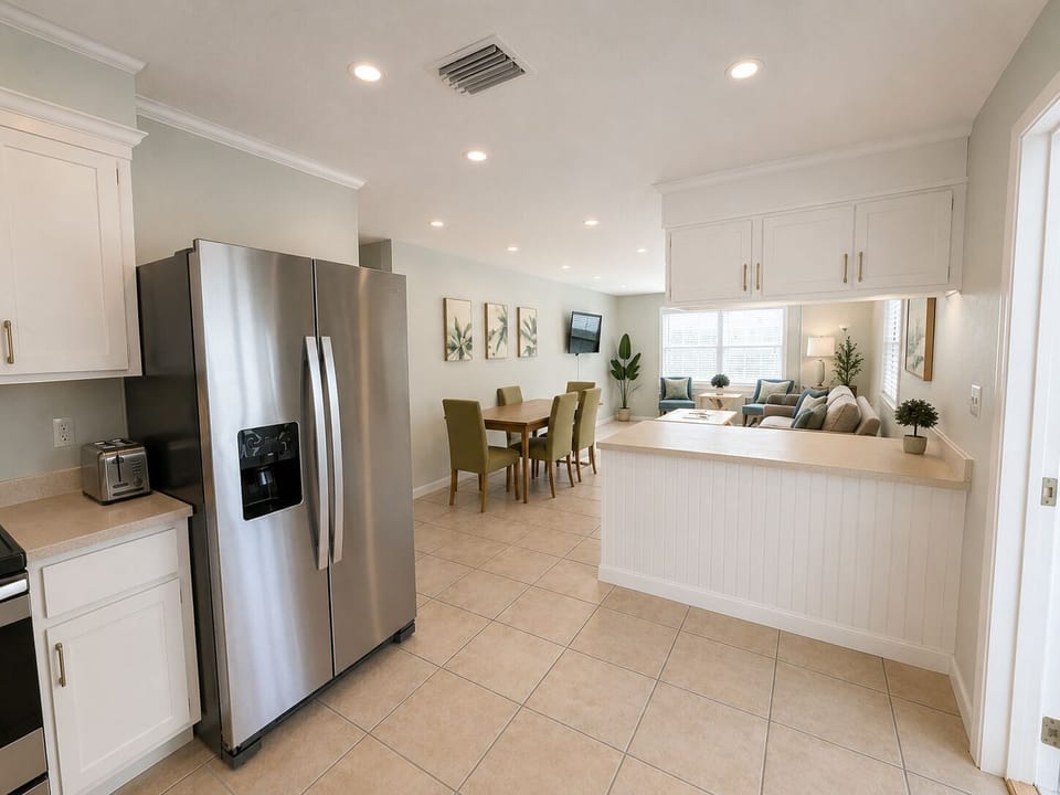 The kitchen overlooks the pool as well as teh living/dining area.