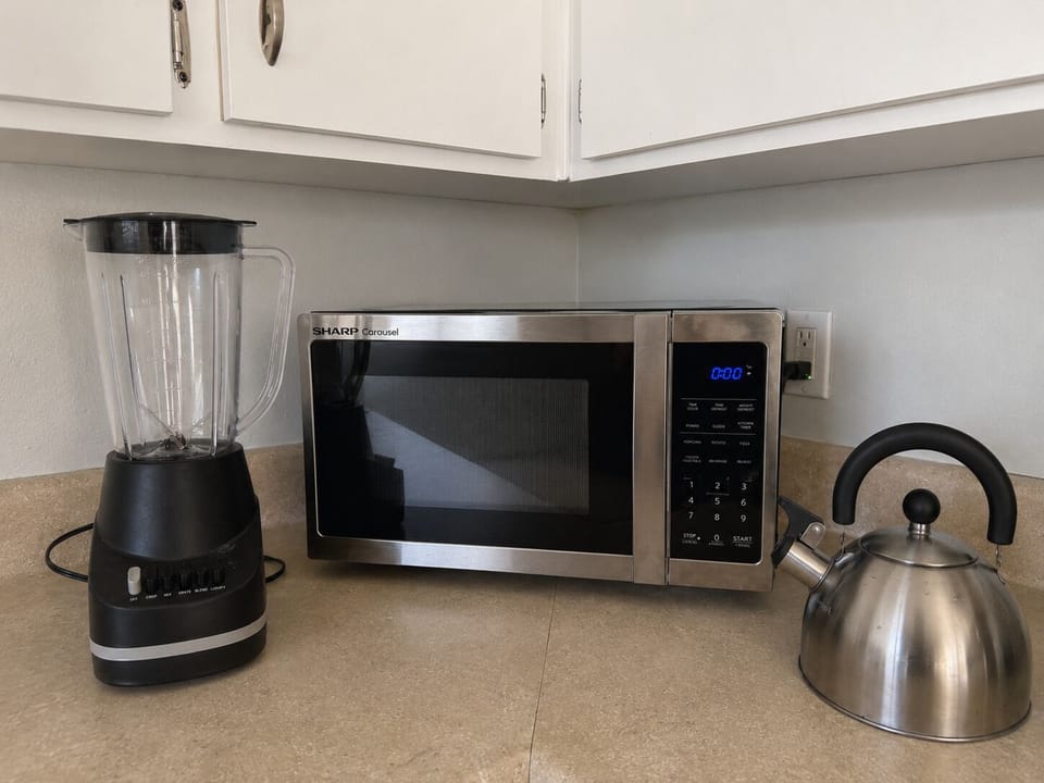 All basic kitchen appliances are provided, including a microwave, blender, and tea pot (and coffee maker/coffee).