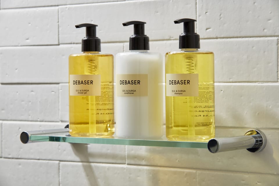 Shower, designer toiletries, hair dryer, bathrobes