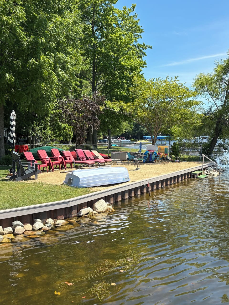 PRIVATE Beach with plenty of seating with a 4 step entry w railing to lake.
. 