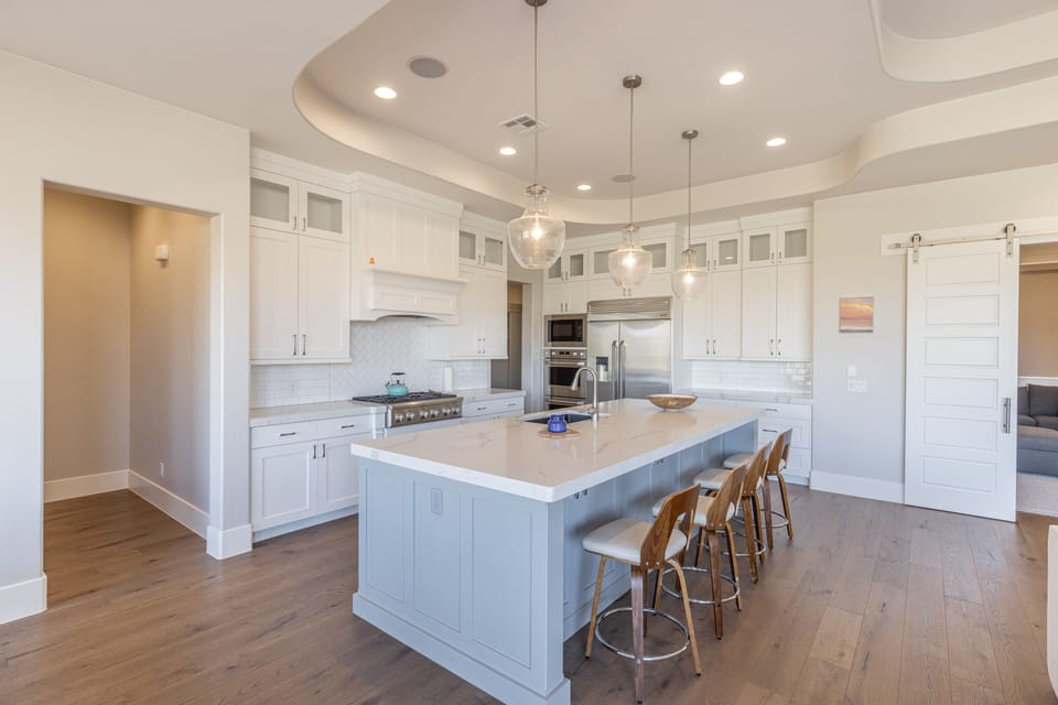 Kitchen - The kitchen is fully stocked with all the dishes, cookware, baking pans, and cutlery you will need for meal preparations and includes stainless steel appliances and granite counter tops.