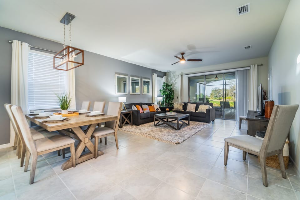 Open plan living area showing patio doors to pool
