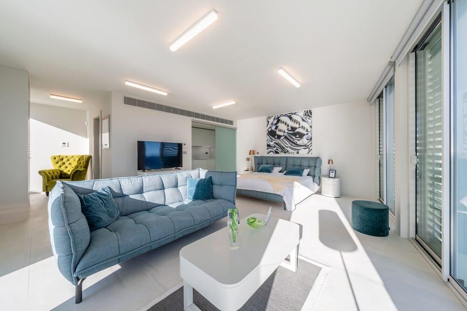Panoramic Studio | Living area | Flat-screen TV