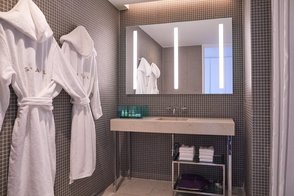 Designer toiletries, hair dryer, bathrobes, towels