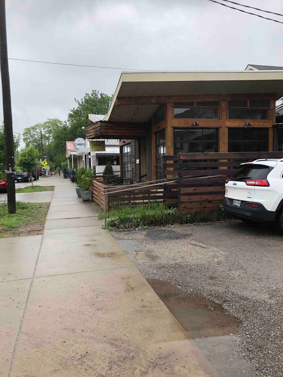 A street view looking down Belmont Boulevard at the multiple restaurants and bars which are a short stroll from your apartment.