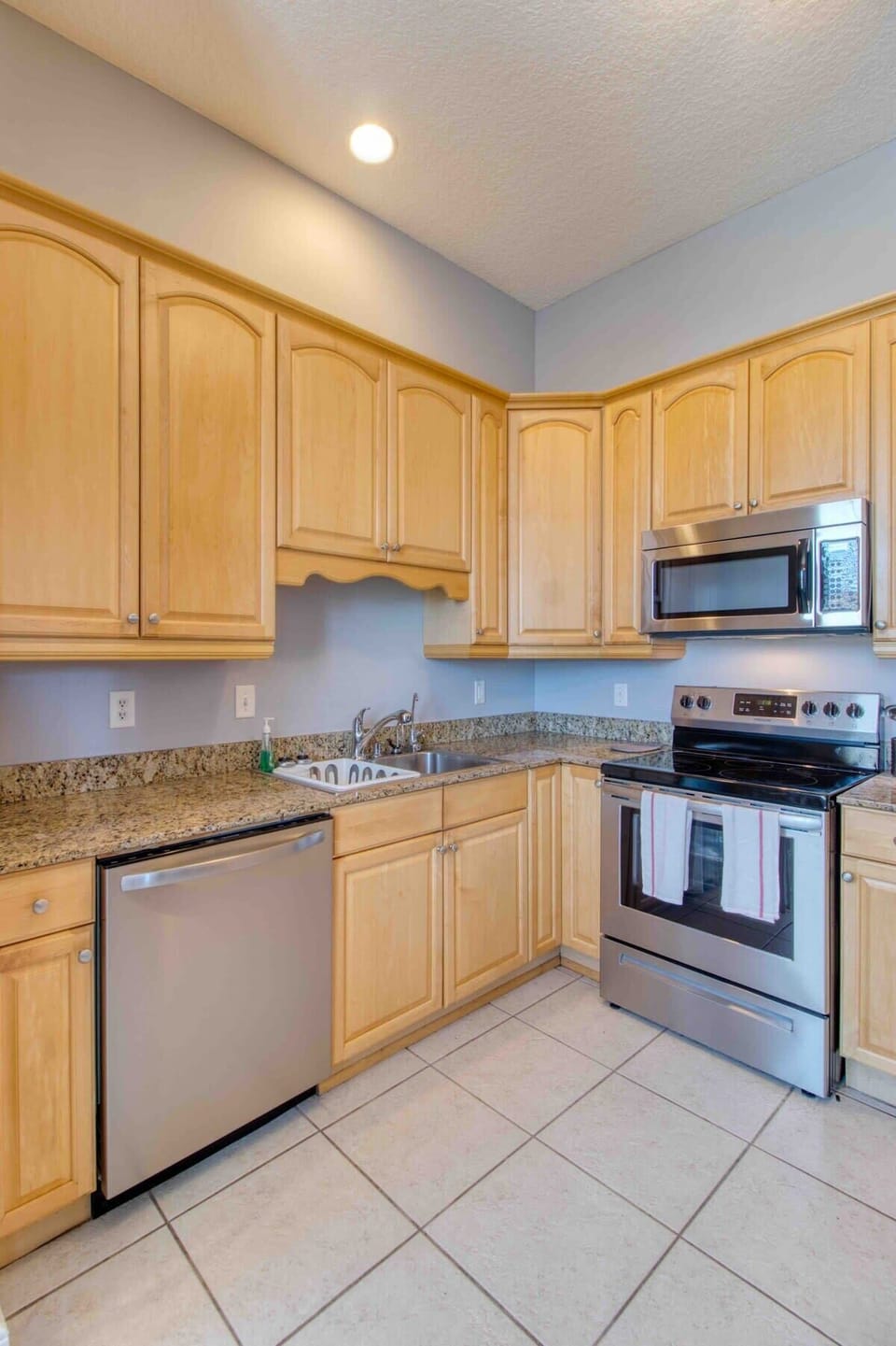Modern dishwasher is available for quick cleaning after serving close friends and family a home cooked meal