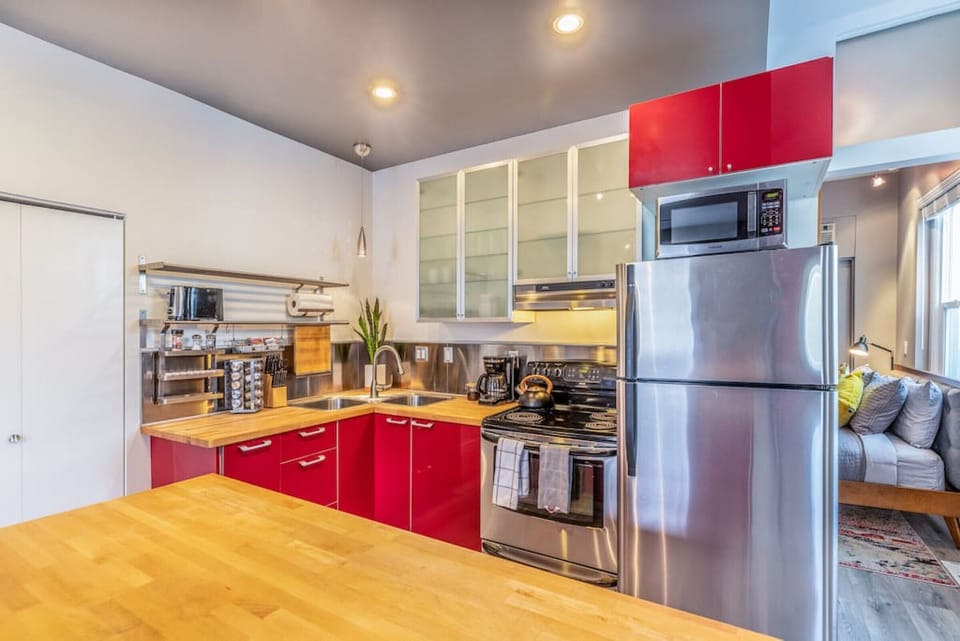 The cabinets, with their sleek finishes and modern design, add a touch of sophistication while keeping everything organized.