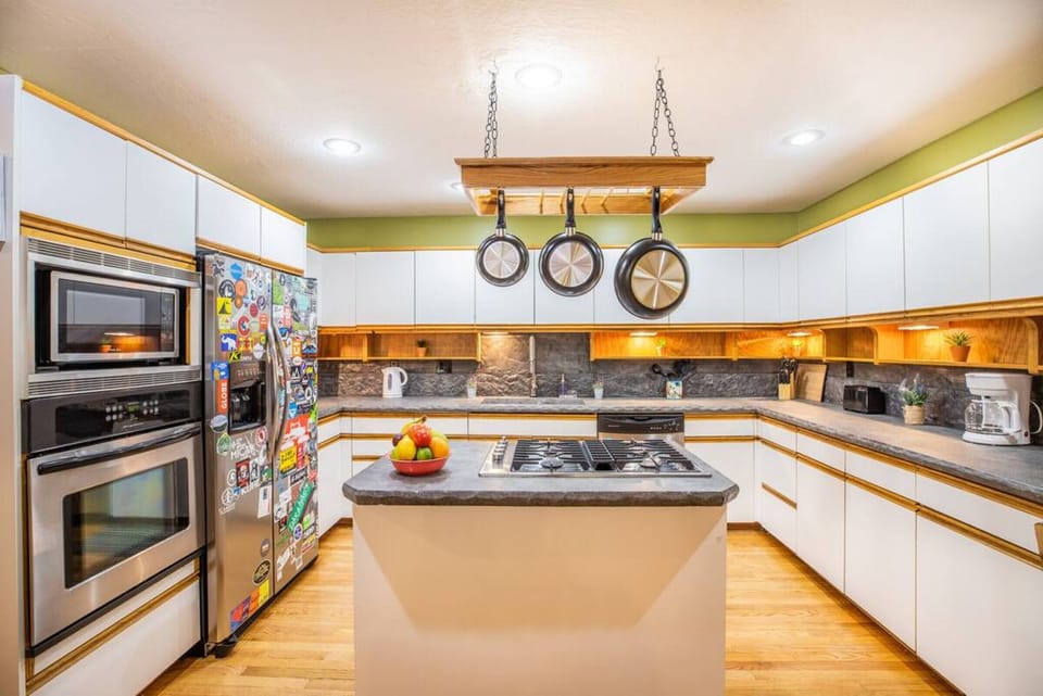 Spacious kitchen with premium utensils for effortless cooking.