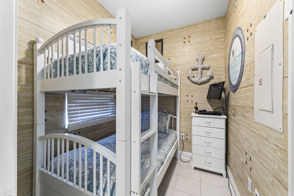 Bunk room with two twin beds, flat screen TV