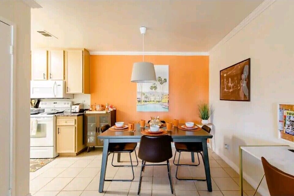dining room with large rectangular table and 4 comfortable chairs